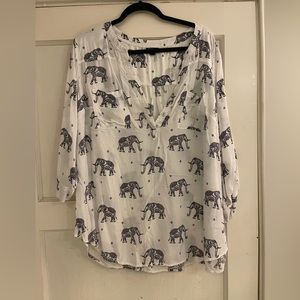Torrid Size 3 White blouse with pastel elephants and roll sleeves.